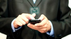 stock-footage-businessman-using-mobile-phone-for-text-messaging1